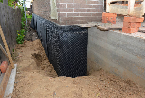 Happy homeowners after waterproofing job in Bowie